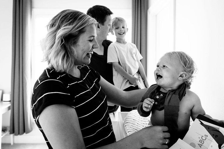 Family laughs getting ready for bed 