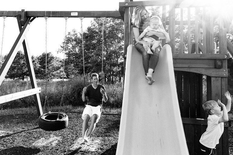 Family plays on the play structure together 