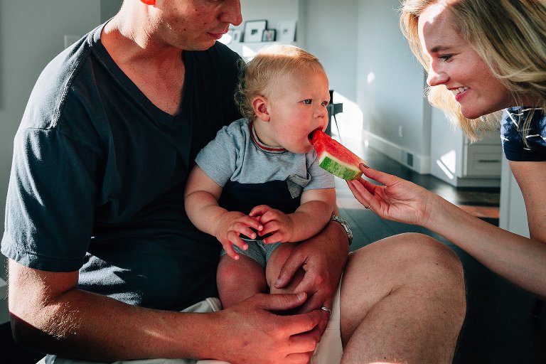mom shares watermelon with toddler