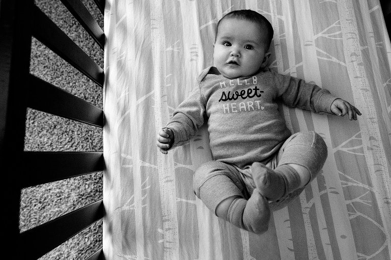 Baby makes eye contact in crib