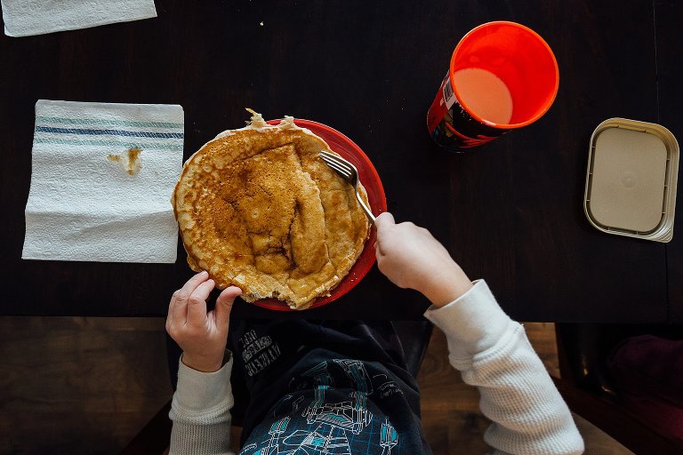 Overhead shot of boy's huge circle pancake 