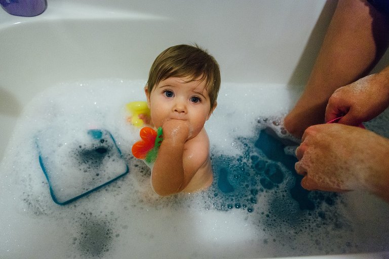 9 month old baby takes a bath