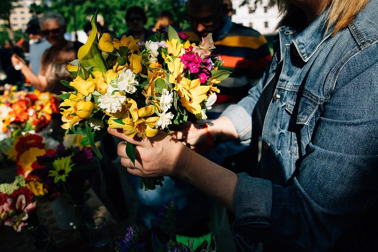 Woman holds summer bouquets