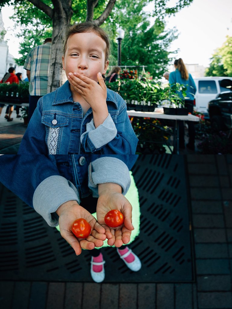 Girl pops farmer's market cherry tomatoes in mouth 