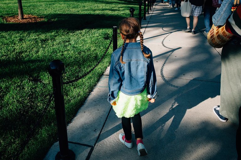 Girl's braids match the braided rope shadow at Farmer's Market