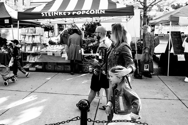 Family walks through Wisconsin Farmer's Market together