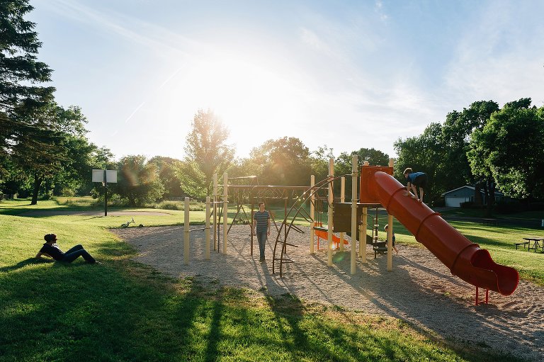 Wide scene of family at the park. 