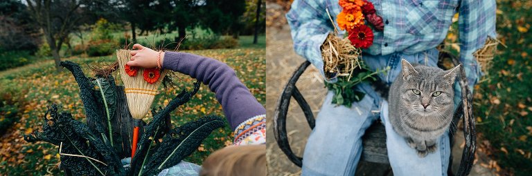 Girl adds flower "eyes" to broom "head" on a scarecrow; gray cat sits on scarecrow lap. 