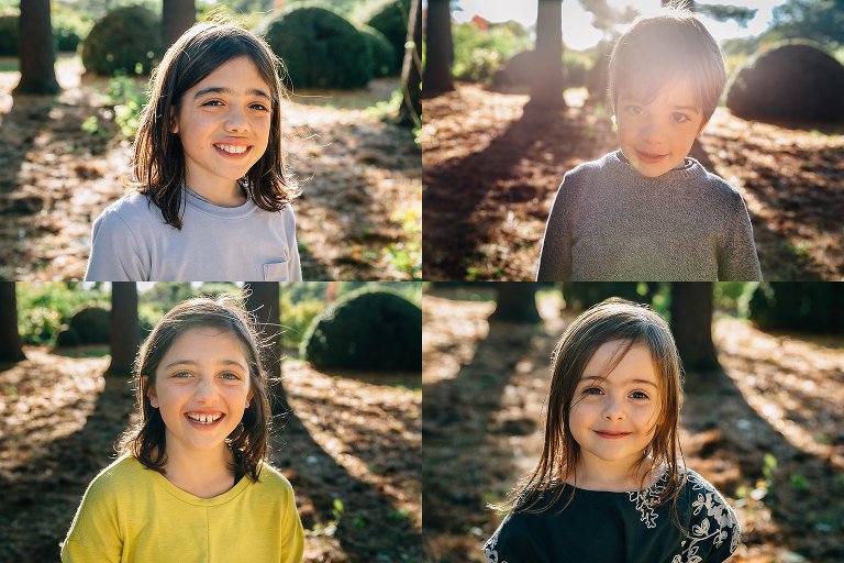 Four siblings smile for a picture outside.