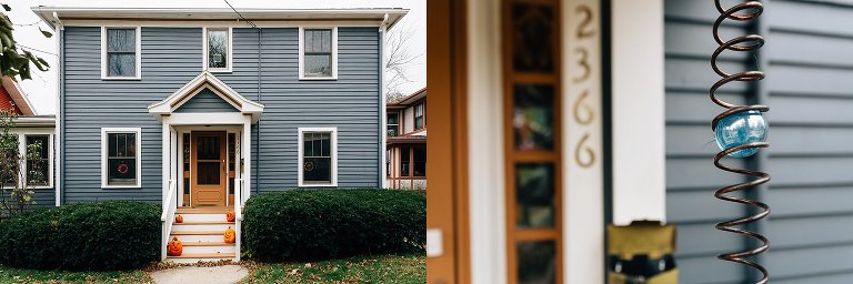 Blue house with metal hang blue ball hanging on front porch.