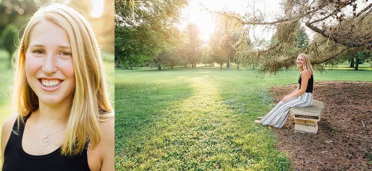 Color. High school senior girl smiles and makes eye contact with the calendar; high school senior sits on a bench under a large evergreen tree. 