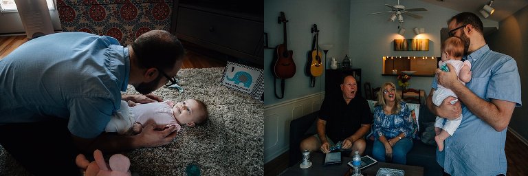 dad engages with daughter on the floor--laughing and smiling. Dad holds infant daughter while grandparents look on and make excited faces. 
