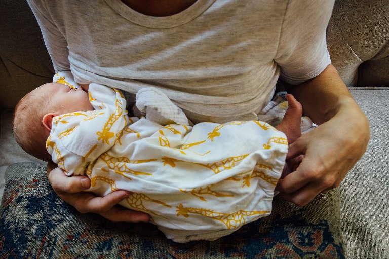 Nursing newborn baby.