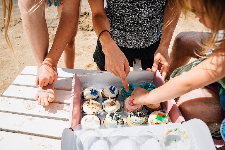 Top down shot of open box of cupcakes. 