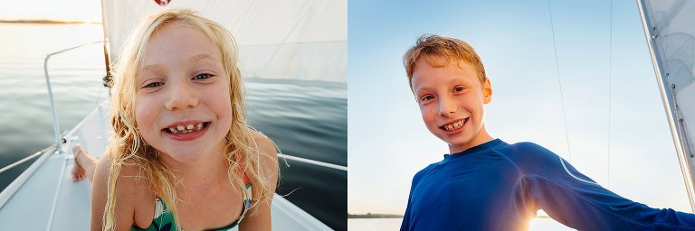 Girl and boy on sailboat at sunset.