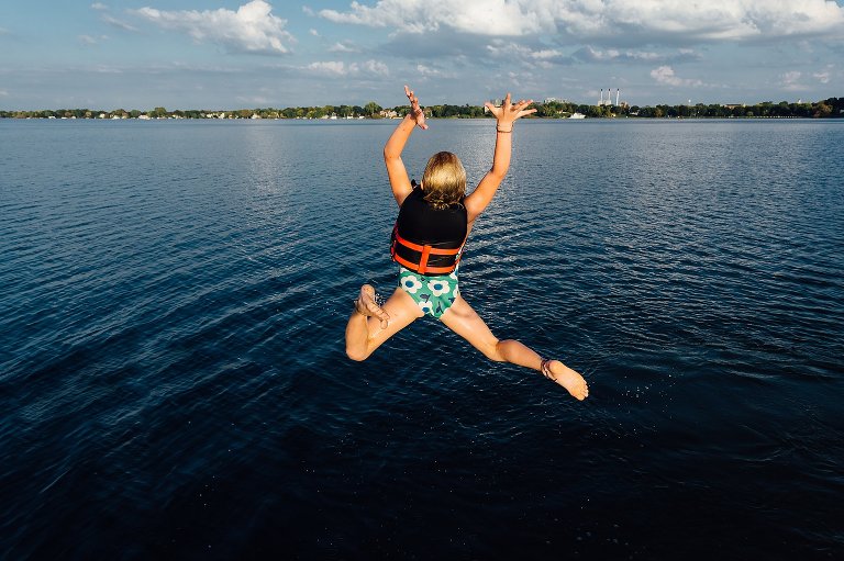 Girl jumps into lake with extreme joy!