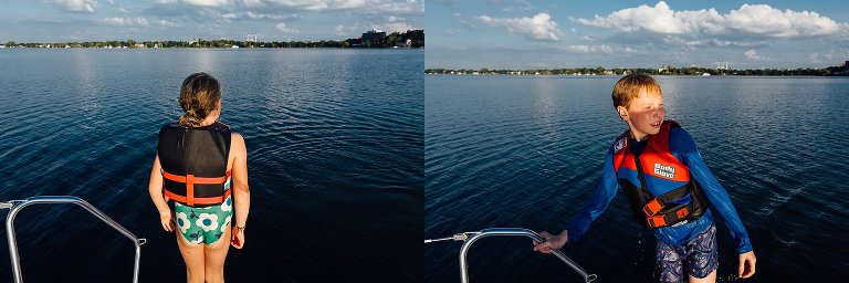 Boy and girl get ready to jump of sailboat.