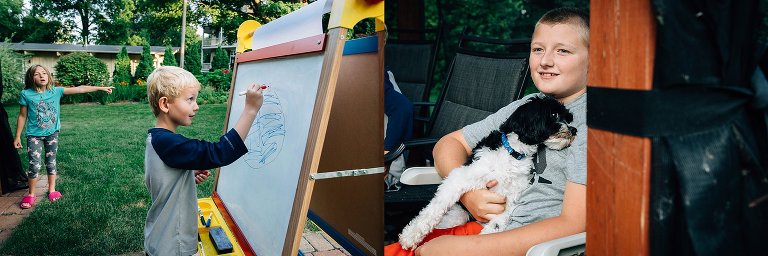 Two boys watch Pictionary game. 