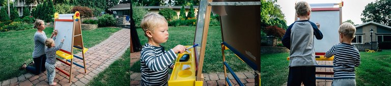 Kids play Pictionary in the backyard at dusk. 