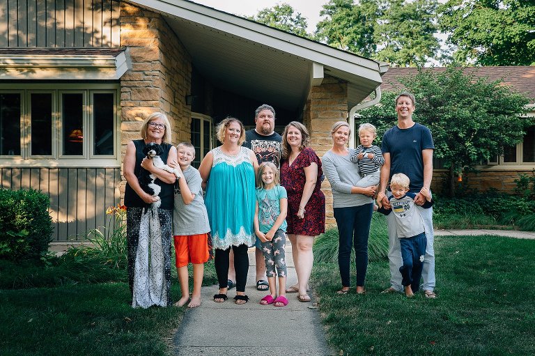 Family portrait in front of the house. 