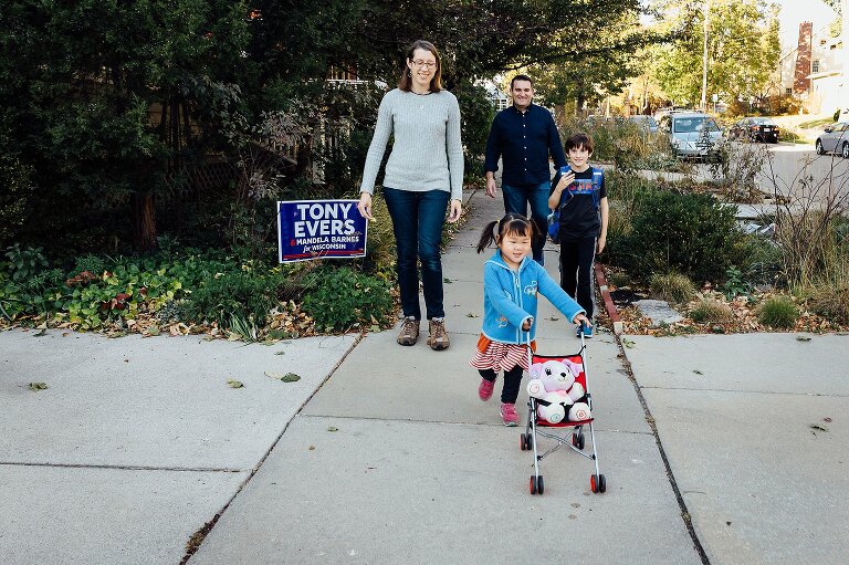 Family takes a walk in the neighborhood. Outside Family Photography Activity Ideas