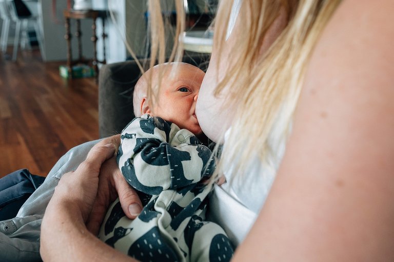 Newborn baby nurses at home 