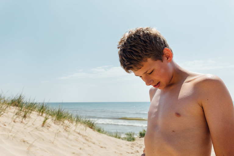 Teen on the sand dunes in summertime.
