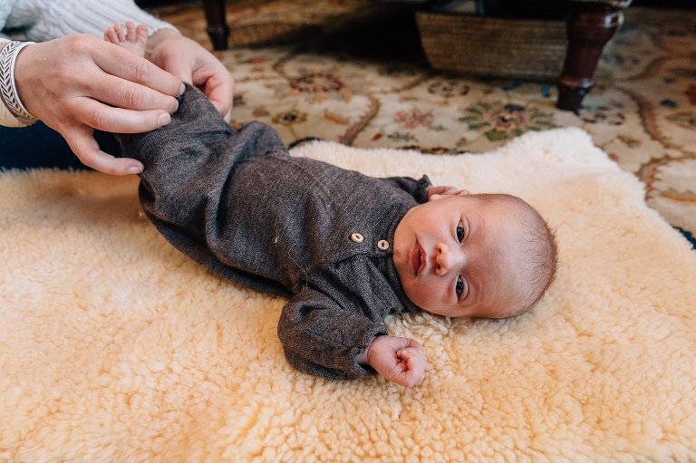 Side view of newborn getting a change of clothes. 