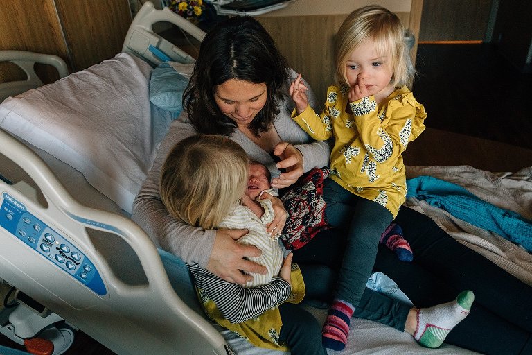 Mom and 3 kids at hospital. 