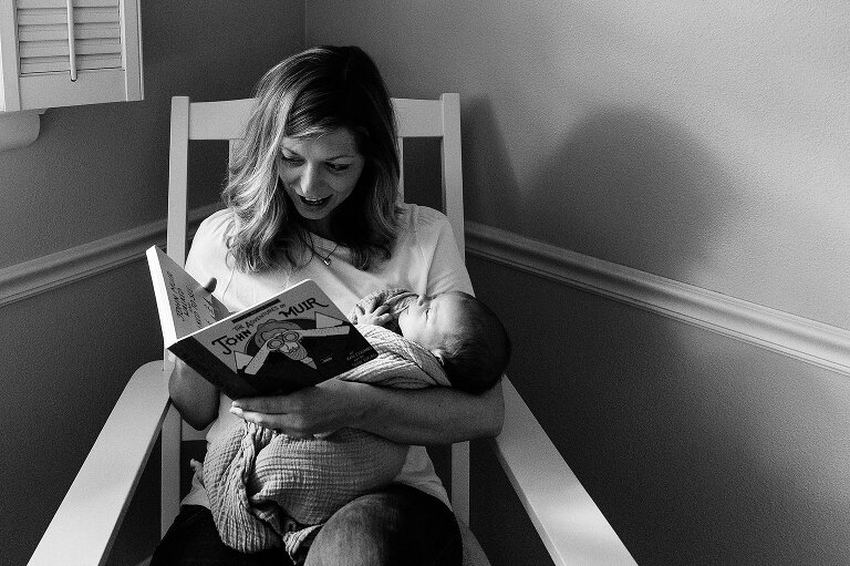 Mother and father look at their newborn son.