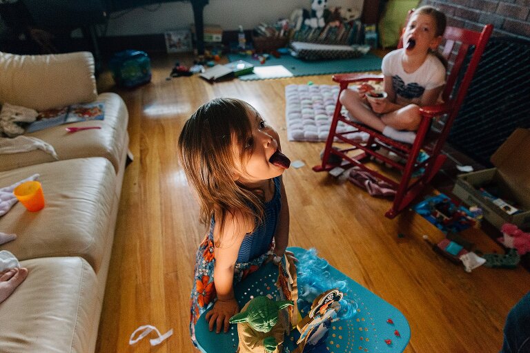 Girls show off their dark blue blueberry stained tongues.