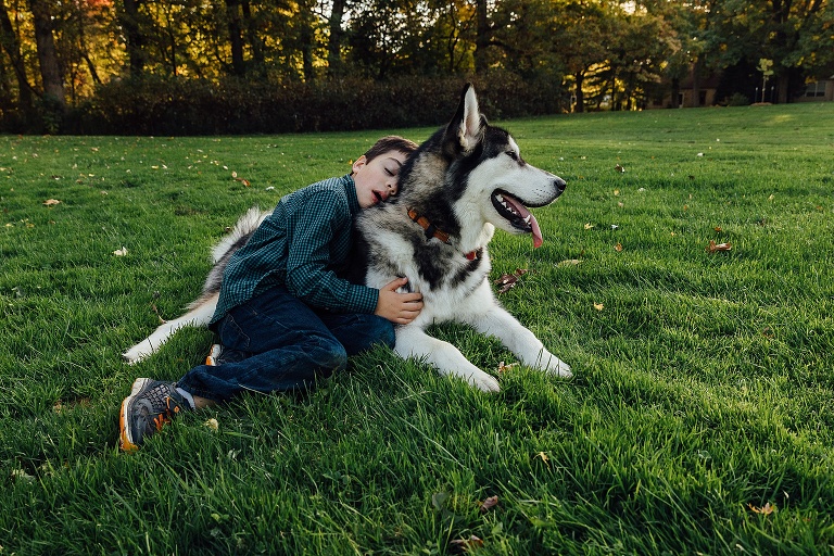 doggo cuddles with human for family photography session