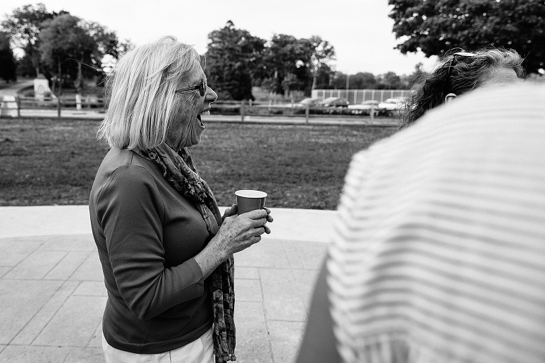 elderly woman has big smile for someone off camera 