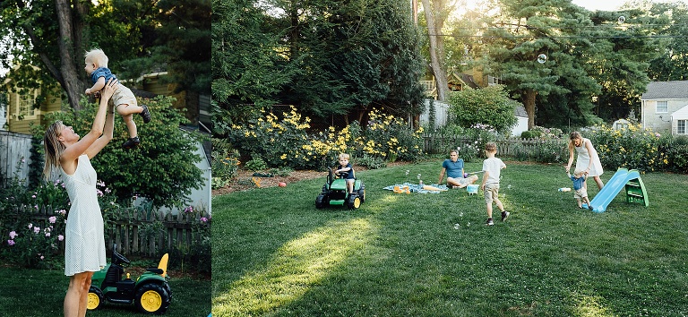 woman tosses infant son in the air in the backyard; family of five play in a backyard on a summer nights 