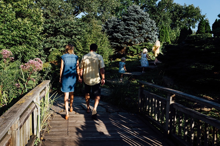 family of five walks through Olbrich Gardens