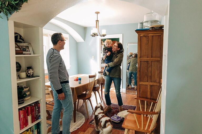 parents and child get ready to go outside 