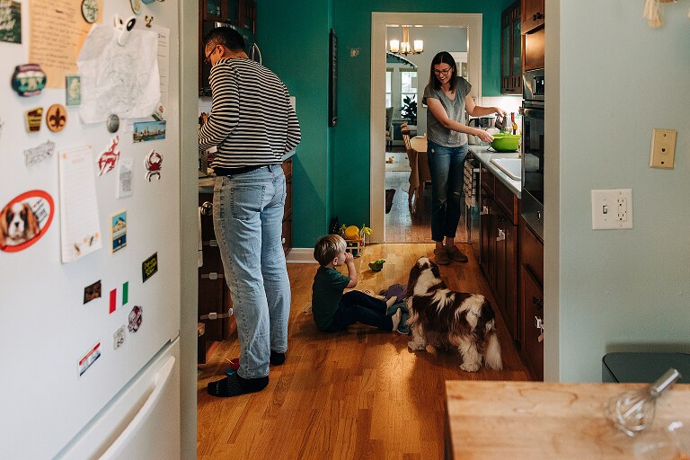 family of three play in the kitchen on Saturday pancakes 