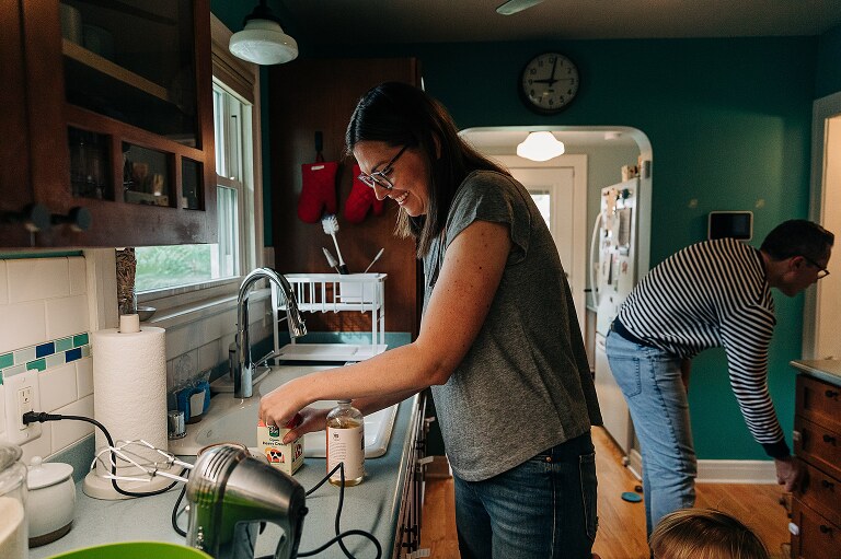 mom preps heavy cream for whipped cream on top of pancakes