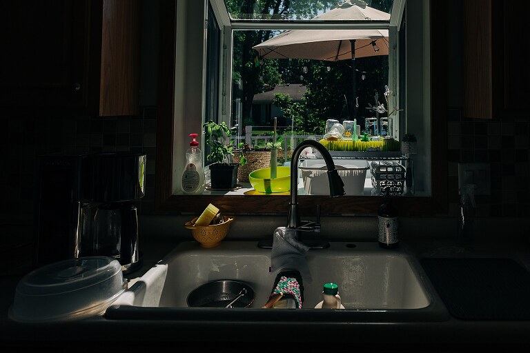 A sunny window of bottles drying on a quiet summer morning 