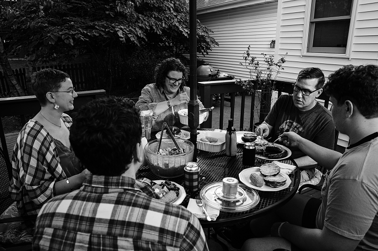 Black and white: family begins eating their meal
