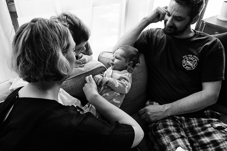 newborn smiles at older brother