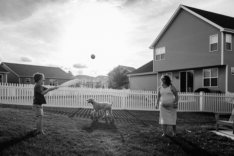 pregnant mother tosses baseball to son with a bat