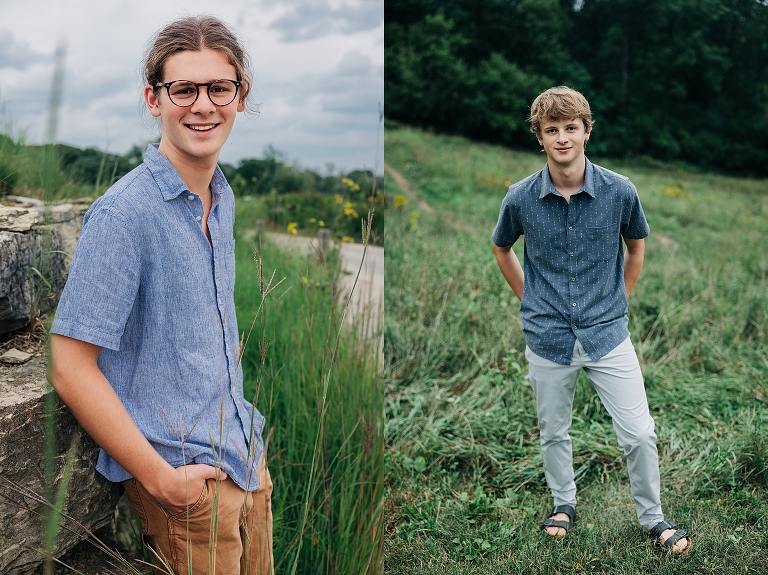 two senior boys standing in fields of grass