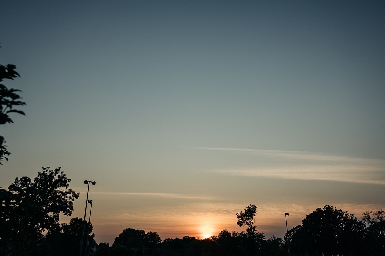 Dusk befalls the Tenney Park Documentary Wedding as the sun ducks below the tree line