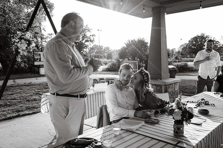 Black and white: Man gives toast to the newly wed couple at Tenney Park Documentary Wedding reception