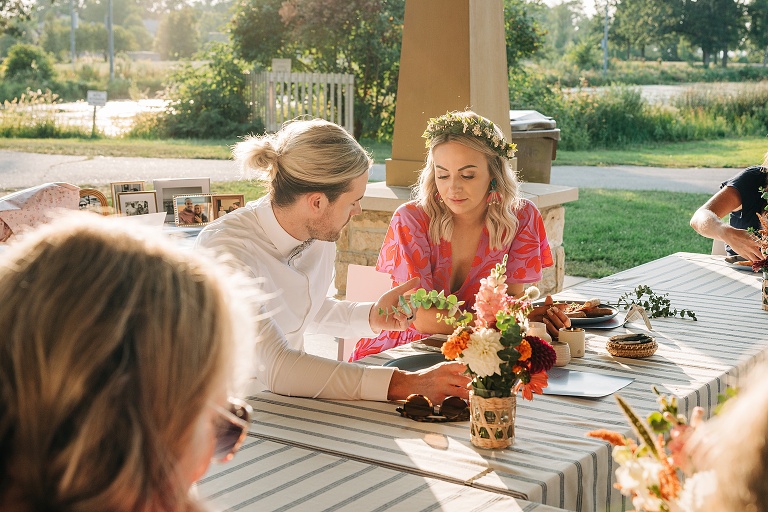 Husband and wife converse at Tenney Park Documentary Wedding reception
