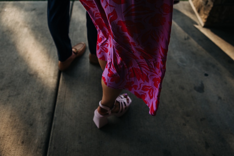 The back of the husband and wife's legs and shoes