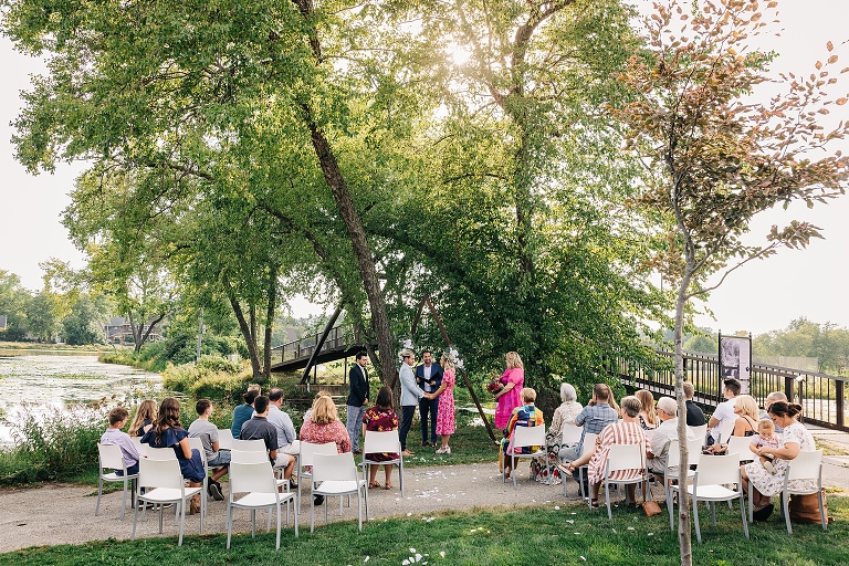 A wide angle of the Tenney Park Documentary Wedding showing the ceremony and the guests
