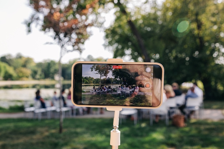 Photo shows iPhone on tripod video recording Tenney Park Documentary Wedding