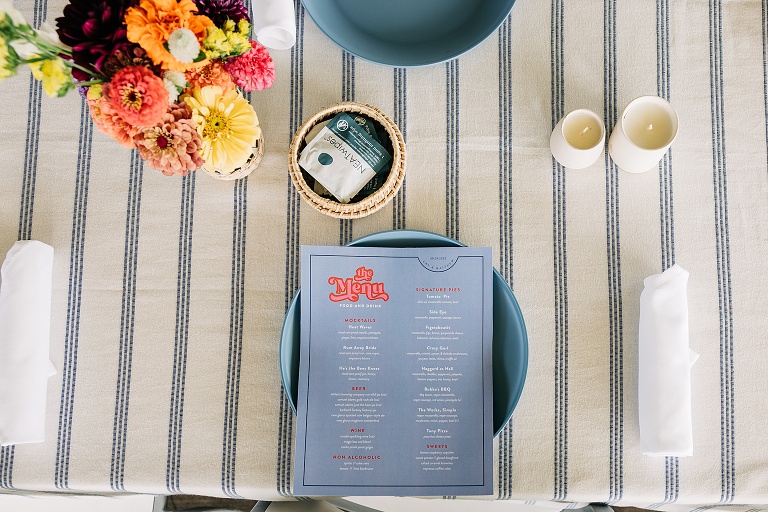 Top down: Menu and flowers at Tenney Park Documentary Wedding